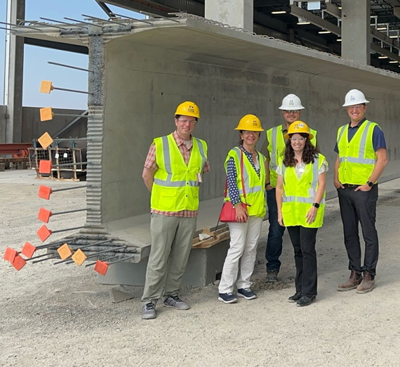 man with white hair at podium